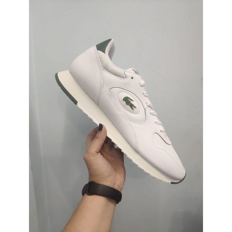 Zapatilla Blanca con Contrafuerte Verde – Comodidad y Estilo